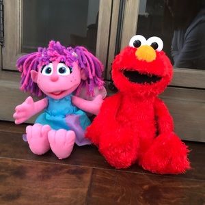 Tickle me elmo and Abby Cadabby toys
